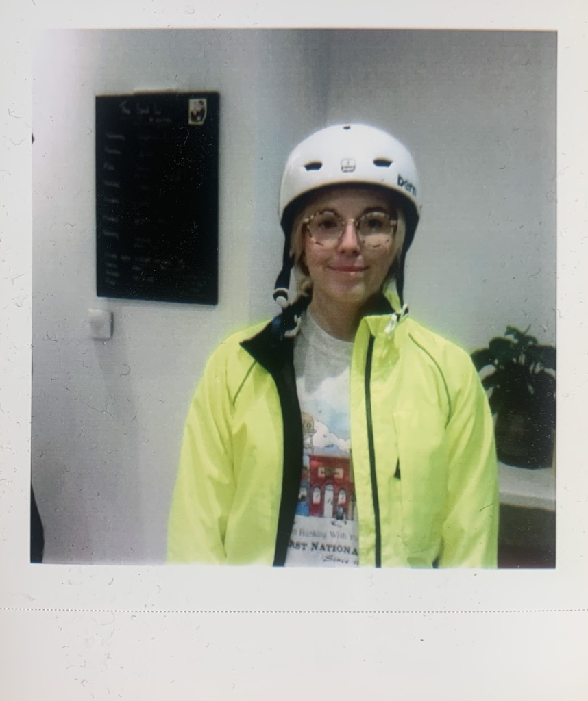 blonde girl wearing a cycling hat